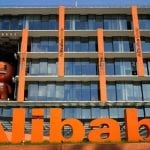Alibaba shares jump up to 6% in Hong Kong debut