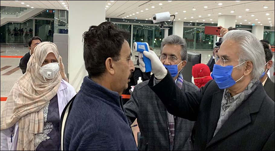 Dr Zafar Mirza inspects screening process