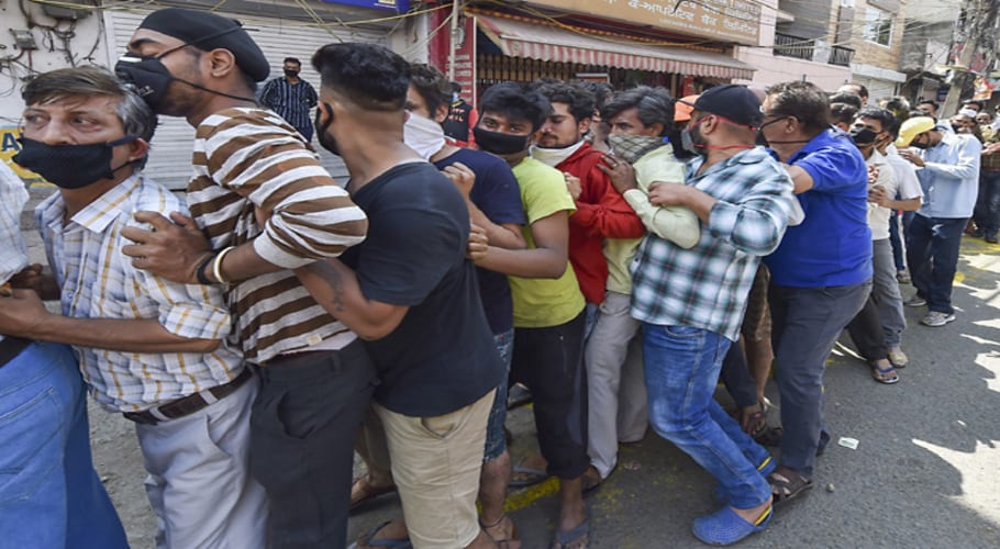 Chaos outside liquor shops as India eases coronavirus lockdown