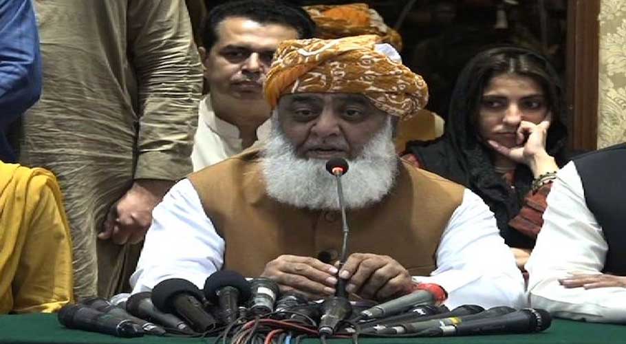 Maulana Fazl addressing a press conference in Peshawar