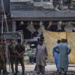 Police and locals stand near the site of an explosion in Lahore. Source: AFP/FILE
