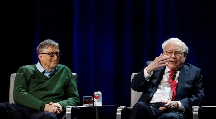 Warren Buffett, chairman and CEO of Berkshire Hathaway, speaks while Bill Gates looks on. Source: Reuters