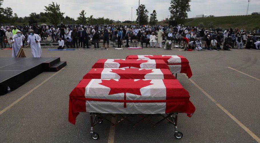 Flag-wrapped coffins are seen during a funeral of the Afzaal family that was killed in a hate-motivated attack. Source: Reuters