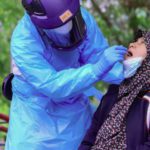 A medical officer conducts a Covid-19 coronavirus test on a woman in southern Thailand. Source: AFP 