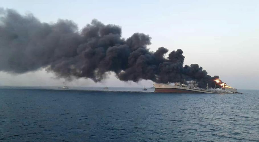 Smoke rises from Iran navy’s largest ship in Jask port in the Gulf. Source: Reuters.