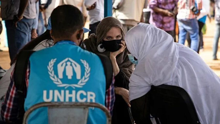Angelina Jolie speaks with Malian refugees at a camp in Goudebo, in northern Burkina Faso. Source: AFP