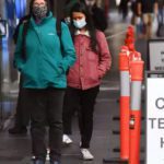 People wait in queues at a Covid-19 testing centre in Melbourne as the city scrambles to contain a growing outbreak. Source: Guardian/AFP/Gettys