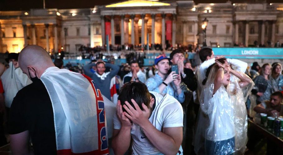 England fans react after Italy wins the Euro 2020 at Trafalgar Square. . Source: Reuters