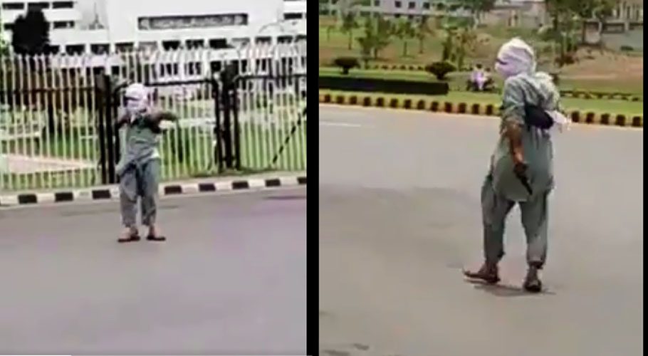 A man was roaming outside the Parliament House with a gun. Source: Twitter.