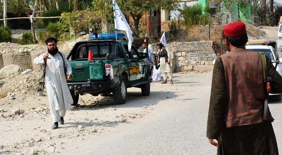 Taliban members inspect the site of a blast in Jalalabad. (Source: AFP)