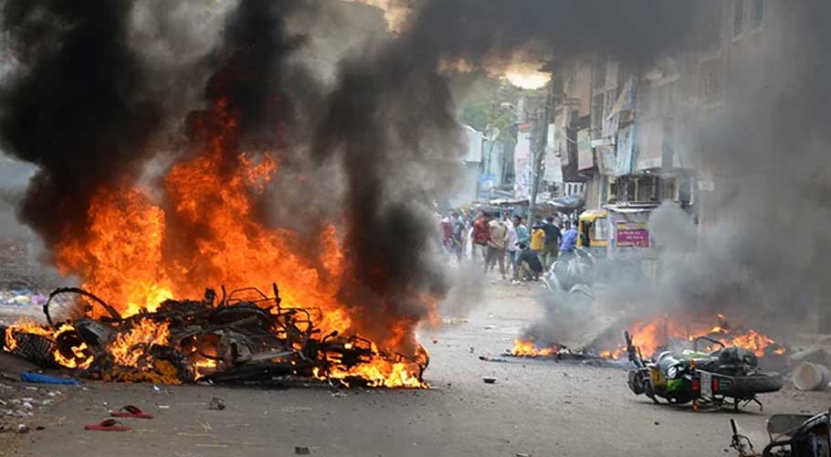 Vehicles were set on fire by a mob during a clash in India. — Reuters/File