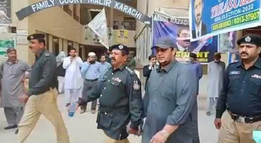 Police escort PPP MPA Jam Awais to a local court in Karachi. (Source: Dawn)