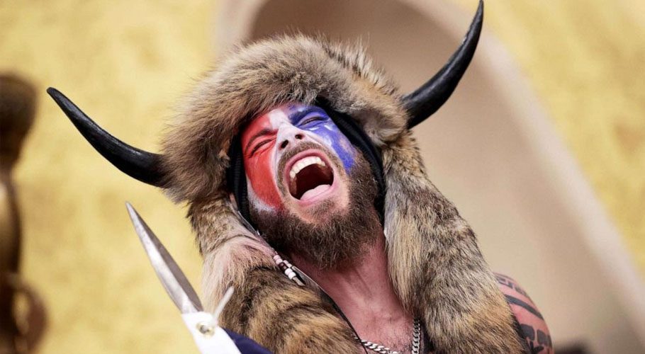 The rioter was known as "QAnon Shaman" for his horned headdress. Source: ABC News.