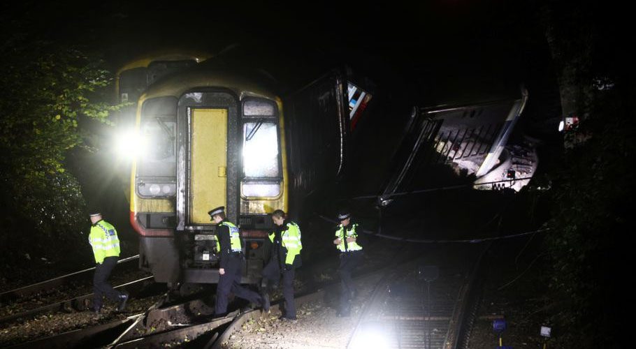 Police officers inspect the site where two trains collided near Salisbury. Source: Reuters. 