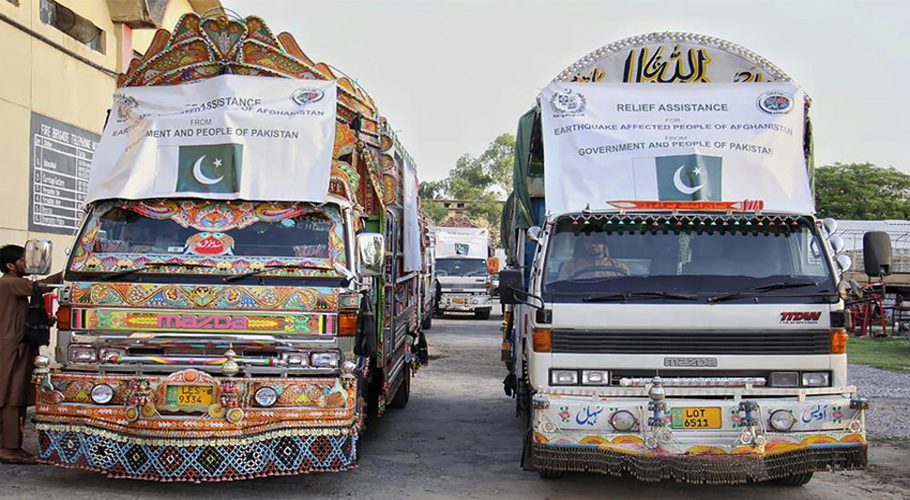 In this photo released by Pakistan's National Disaster Management Authority, a convoy of truck carrying relief good including tents, blankets and emergency medicines for Afghanistan's earthquake hit areas, prepare to leave for Afghanistan at a warehouse in Islamabad, Pakistan, Thursday, June 23, 2022. (National Disaster Management Authority via AP)