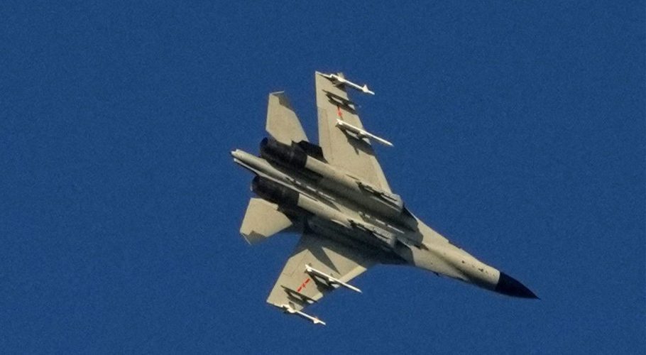 A Chinese People's Liberation Army (PLA) aircraft flies over the 68-nautical-mile scenic spot, one of mainland China's closest points to the island of Taiwan, in Pingtan island, Fujian province, China August 5, 2022. REUTERS/Aly Song