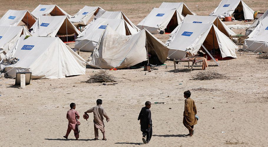 Displaced children walk outside their family tents in a camp, following rains and floods during the monsoon season in Sehwan, Pakistan, on September 16, 2022. (REUTERS)