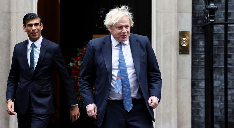Boris Johnson and Rishi Sunak walk out of Downing Street, in London, Britain, December 1, 2021. REUTERS/Henry Nicholls/File Photo