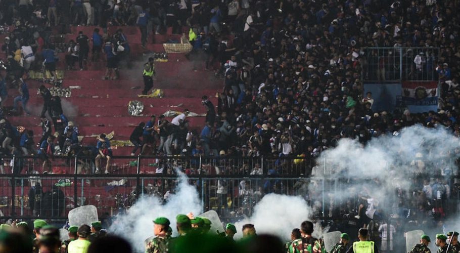 At least 127 people died at a football stadium in Indonesia when fans invaded the pitch and police responded with tear gas STR AFP