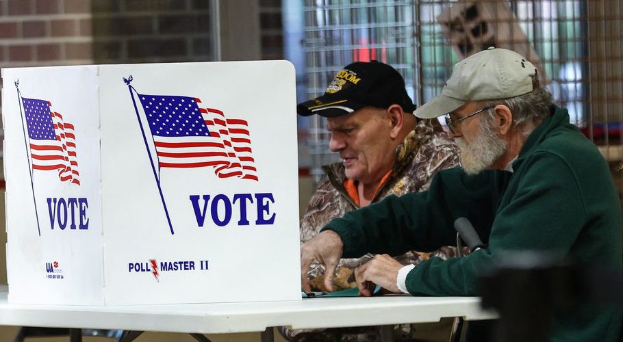 Voters fill out ballots at a polling station during the 2022 U.S. midterm election in downtown Harrisburg, Pennsylvania, U.S., November 8, 2022. REUTERS/Mike Segar
