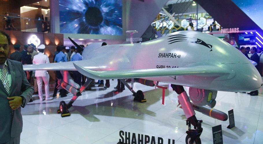An official walks past a Pakistan’s unmanned combat aerial vehicle Shahpar-II during the International Defense Exhibition and Seminar (IDEAS) 2022 at the Expo Centre in Karachi. Photo: AFP