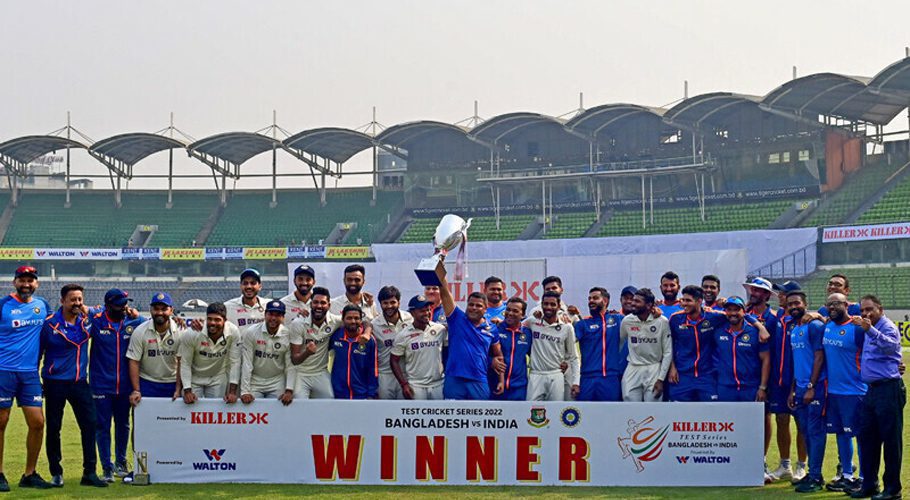 India’s cricket team poses for a photo as they hold the tournament trophy after winning on the fourth day of the second cricket Test match between Bangladesh and India at the Sher-e-Bangla National Cricket Stadium in Dhaka on December 25, 2022. — AFP