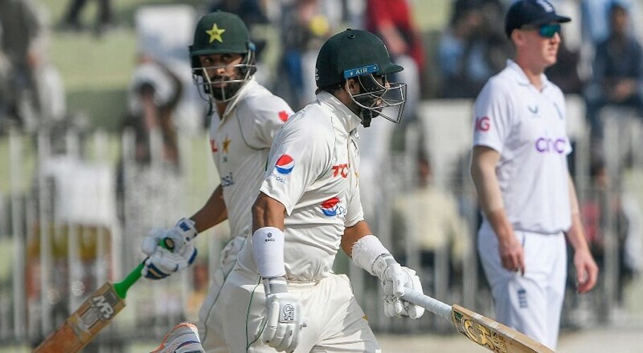 Pakistan’s Abdullah Shafique (L) and teammate Imam-ul-Haq (C) run between the wicket during the second day of the first cricket Test match between Pakistan and England at the Rawalpindi Cricket Stadium, in Rawalpindi on Friday. — AFP