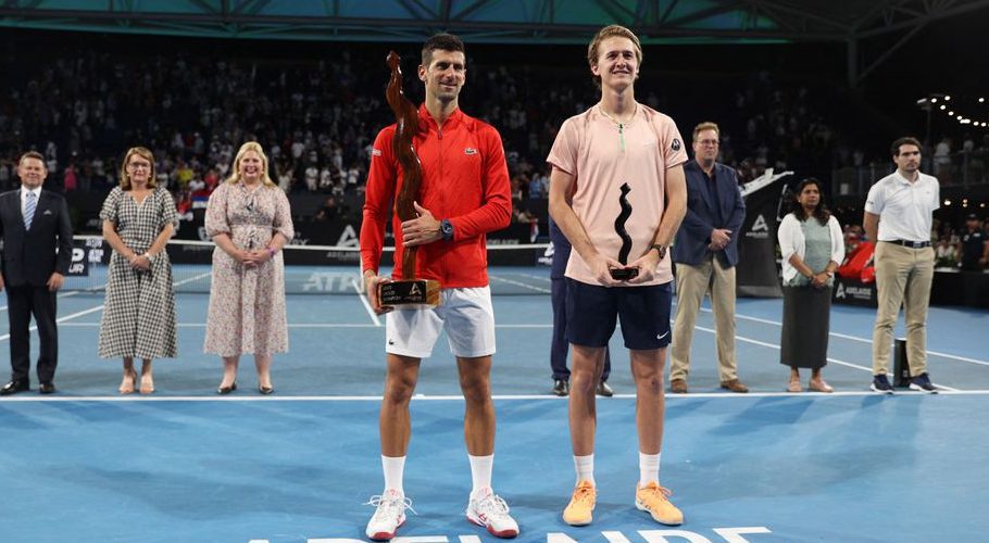 Adelaide International - Memorial Drive Tennis Club, Adelaide, Australia - January 8, 2023 Serbia's Novak Djokovic poses with the trophy after winning the final alongside runner-up Sebastian Korda of the U.S. REUTERS/Loren Elliott