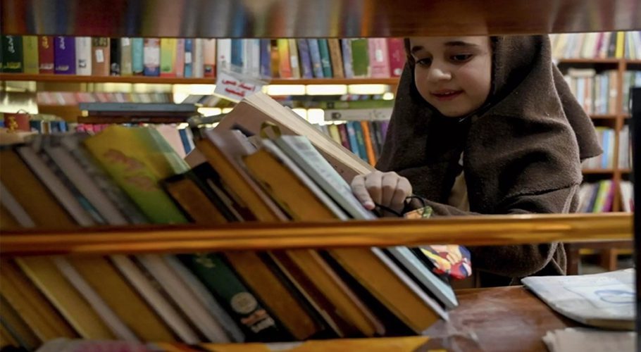 A student browses books at the Darra Adamkhel library. Photo: AFP