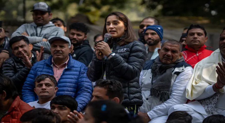 Indian wrestler Vinesh Phogat speaks during a protest against Wrestling Federation of India President Brij Bhushan Sharan Singh and other officials in New Delhi [Altaf Qadri/AP Photo]