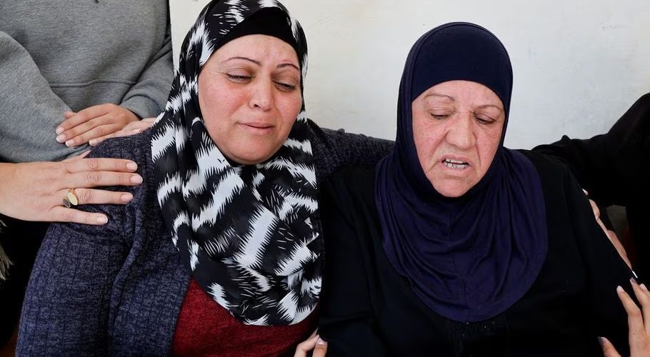 Family members of a Palestinian man, who was killed by Israeli forces after an attempted stabbing, react, near Ramallah, in the Israeli-occupied West Bank, January 21, 2023. REUTERS/Ammar Awad