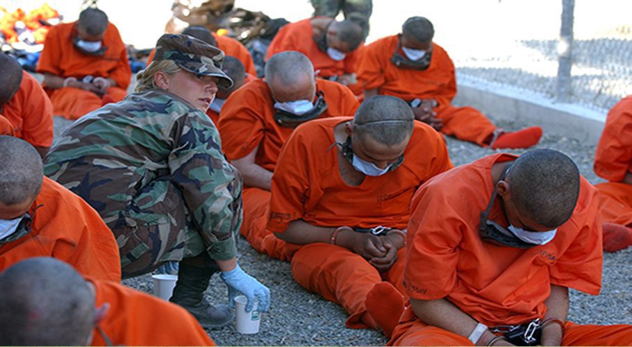 Detainees on arrival to Camp X-Ray, the holding facility at Guantánamo Bay, Cuba. © US DoD
