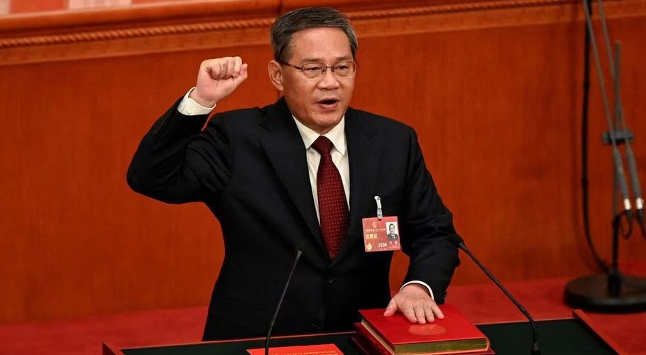 China's newly-elected Premier Li Qiang takes an oath after being elected during the fourth plenary session of the National People's Congress (NPC) at the Great Hall of the People in Beijing, China on March 11, 2023. GREG BAKER/Pool via REUTERS