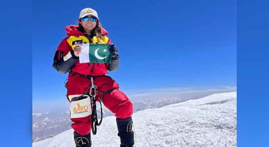 Pakistani mountaineer Naila Kiani seen holding Pakistan's flag at the top of K2. — Instagram/@naila._.kiani
