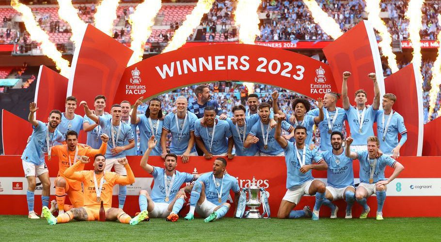 Football - FA Cup Final - Manchester City v Manchester United - Wembley Stadium, London, Britain - June 3, 2023 Manchester City players celebrate with the trophy after winning the FA Cup REUTERS/Carl Recine