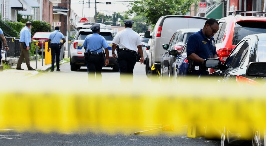 Police officers work at the scene as investigations are ongoing the day after a mass shooting in the Kingsessing section of southwest Philadelphia, Pennsylvania, U.S. July 4, 2023. REUTERS/Bastiaan Slabbers