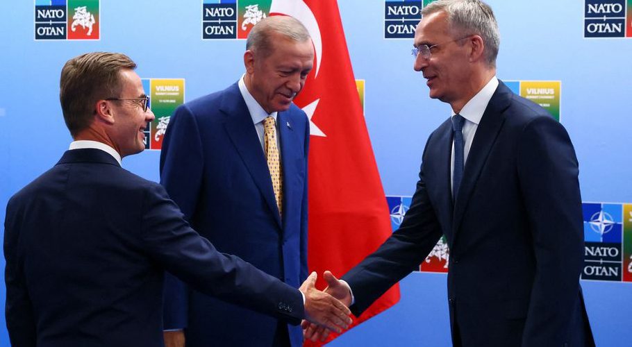 Swedish Prime Minister Ulf Kristersson and NATO Secretary-General Jens Stoltenberg shake hands next to Turkish President Tayyip Erdogan, on the eve of a NATO summit, in Vilnius, Lithuania July 10, 2023. REUTERS/Yves Herman/Pool