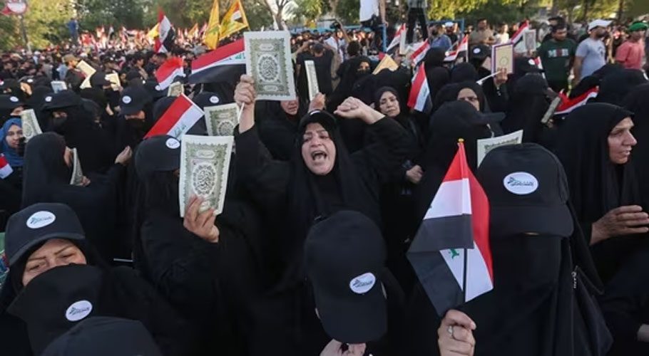Supporters of Iraq's Hashed al-Shaabi (Popular Mobilisation) group take part in a protest denouncing the burning in Sweden of the Koran, Islam's holy book, in al-Jadiriyah area near Baghdad's Green Zone.(AFP)
