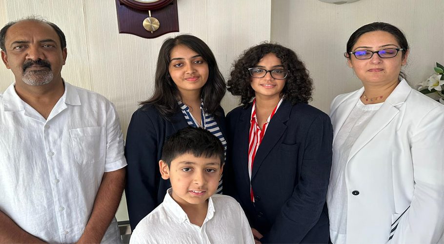 Mahnoor Cheema, (centre) 16, who set a new record with 34 GCSEs can be seen pictured with her parents Usman Cheema and Tayyaba Cheema at her home in Langley West London. — (Image; Geo News)