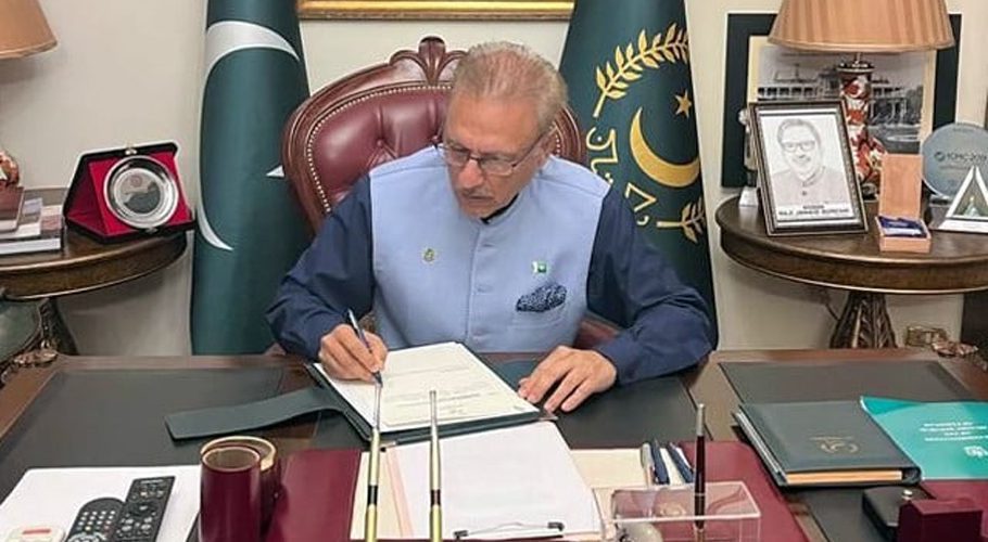 President Dr Arif Alvi denies having signed Official Secrets Act Amendment Act 2023 and Army Act Amendment 2023. He is pictured here giving the green signal to recently passed PEMRA amendment law.PHOTO: PID/FILE