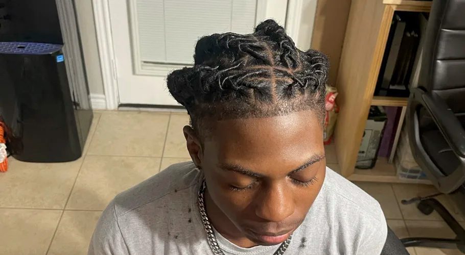 In this photo provided by Darresha George, her son Darryl George, 17, a junior at Barbers Hill High School in Mont Belvieu, Texas, sits for a photo showing his locs, at the family's home, Sept. 10, 2023. The same week a state law went into effect prohibiting discrimination on the basis of hair, George was suspended because his locs did not comply with the district's dress code. (Darresha George via AP)ASSOCIATED PRESSIn this photo provided by Darresha George, her son Darryl George, 17, a junior at Barbers Hill High School in Mont Belvieu, Texas, sits for a photo showing his locs, at the family's home, Sept. 10, 2023. The same week a state law went into effect prohibiting discrimination on the basis of hair, George was suspended because his locs did not comply with the district's dress code. (Darresha George via AP)ASSOCIATED PRESS