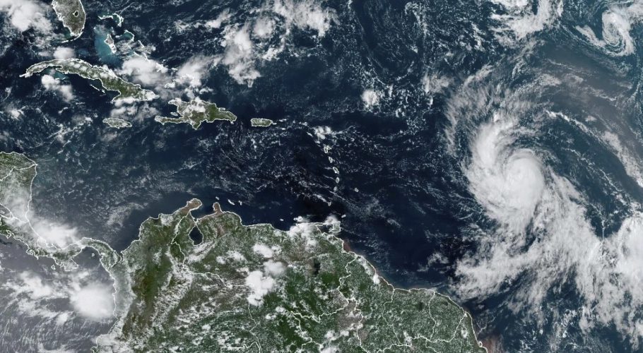 This Wednesday, Sept. 6, 2023, satellite image provided by the National Oceanic and Atmospheric Administration shows Hurricane Lee, right, off in the central tropical Atlantic Ocean. (NOAA via AP)
