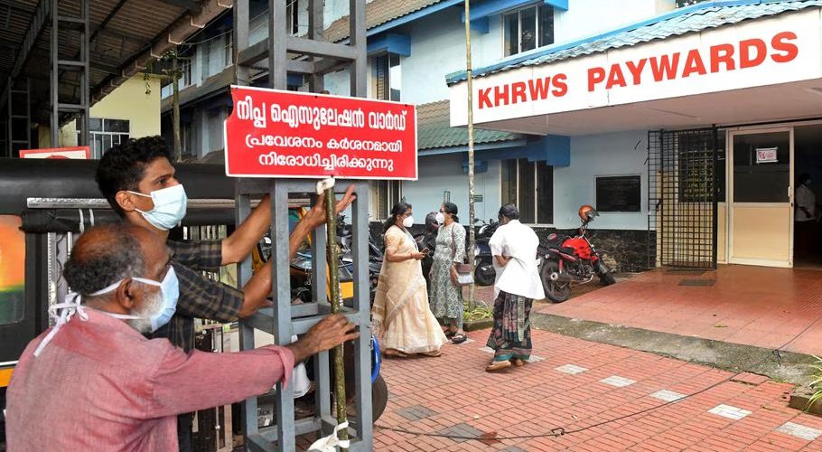 Staff members install a sign reading "Nipah isolation ward, entry strictly prohibited" at a hospital where a ward is being prepared for suspected Nipah virus patients in Kozhikode district, Kerala, India, September 12, 2023. REUTERS/Stringer Acquire Licensing Rights