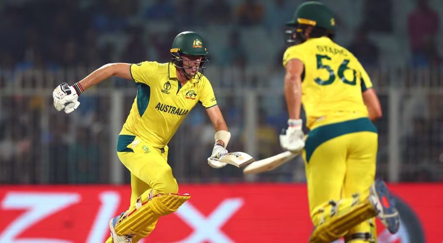 Cricket - ICC Cricket World Cup 2023 - Semi-Final - South Africa v Australia - Eden Gardens, Kolkata, India - November 16, 2023 Australia's Pat Cummins and Mitchell Starc make the runs to win the match REUTERS/Andrew Boyers Acquire Licensing Rights