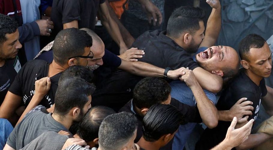 A Palestinian man reacts, as people search for casualties, at the site of Israeli strikes on houses, amid the ongoing conflict between Israel and Palestinian Islamist group Hamas, at the Magazi Refugee Camp, in central Gaza Strip, November 5, 2023. REUTERS/Mohammed Salem Acquire Licensing Rights