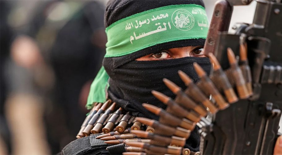 A member of Ezzedine al-Qassam Brigades, military wing of the Palestinian Hamas movement, takes part in a parade in Gaza City on November 14, 2021. (Photo by MAHMUD HAMS/AFP via Getty Images)