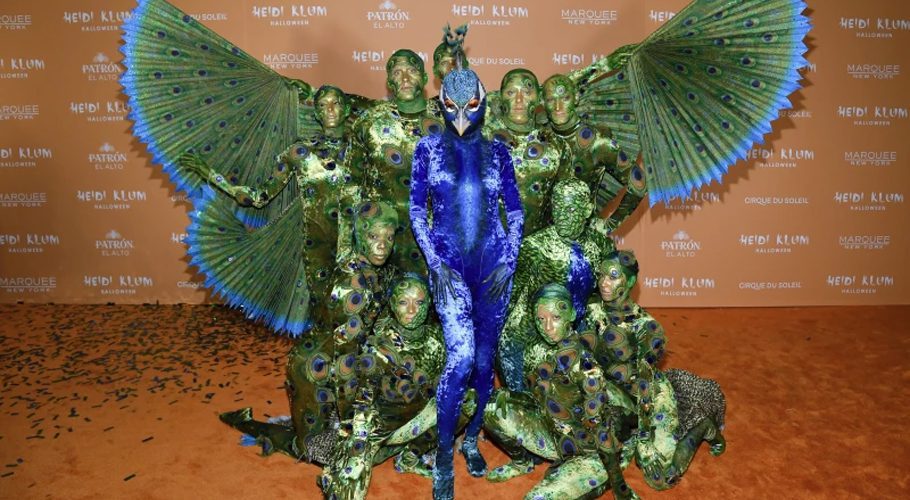 Heidi Klum, center, in blue, arrives at her 22nd annual Halloween party at Marquee on Tuesday, Oct. 31, 2023, in New York. (Photo by Evan Agostini/Invision/AP)
