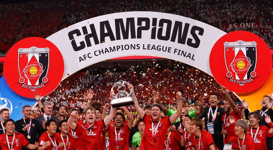 FILE PHOTO: Football - AFC Champions League - Final - Second Leg - Urawa Red Diamonds v Al-Hilal - Saitama Stadium, Saitama, Japan - May 6, 2023 Urawa Red Diamonds' Marius Hoibraten with Alexander Scholz and teammates celebrate with trophy on the podium after winning the AFC Champions League REUTERS/Issei Kato/File Photo Acquire Licensing Rights