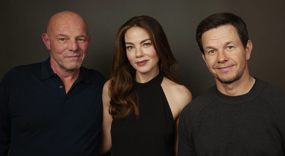 Director Simon Cellan Jones, left, poses with actors Michelle Monaghan, center, and Mark Wahlberg in New York on Dec. 9, 2023, to promote their film "The Family Plan." (Photo by Matt Licari/Invision/AP)