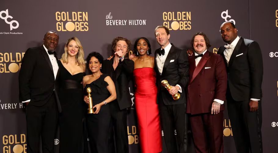 Jeremy Allen White, Ayo Edebiri, Matty Matheson, Ebon Moss-Bachrach, Lionel Boyce, Edwin Lee Gibson and Abby Elliott pose with the award for Best Television Series Musical or Comedy for "The Bear" at the 81st Annual Golden Globe Awards in Beverly Hills, California, U.S., January 7, 2024. REUTERS/Mario Anzuoni Acquire Licensing Rights